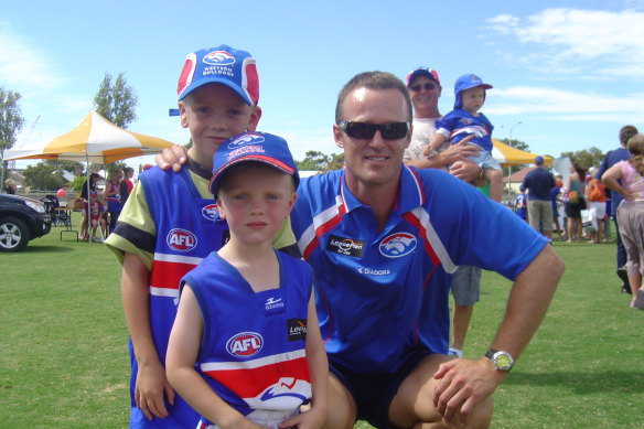 Sam and his older brother, Jack, with Chris Grant.
