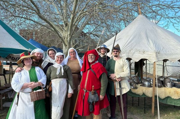 Halcomb, in red, with members of the group (his daughter Rebecca not present).