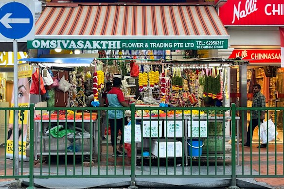 One of the many fresh flower stalls selling marigold garlands in Little India. 