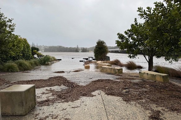 The waters of Lake Burrill leave a picnic area under water after more than 220 millimeter rain breaks down Ulladulla.