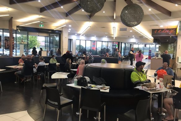 The food court at Plainland, on the Warrego Hwy, has become makeshift accommodation for people stranded by floods. 
