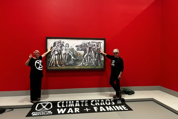 Protesters glue themselves to a Picasso painting at the NGV. 