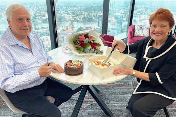 Billionaire Clive Palmer shares a birthday cake with surging One Nation leader Pauline Hanson on Wednesday.