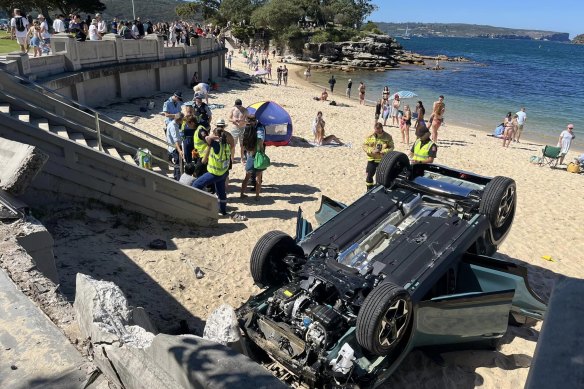 The car crashed through a wall and flipped onto its roof at Balmoral Beach.