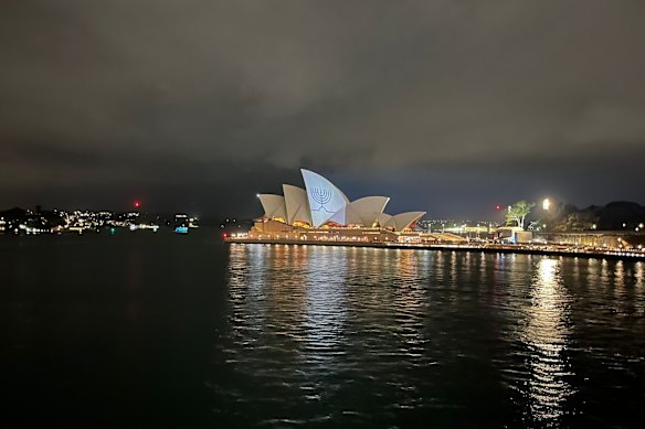The Sydney Opera House illuminated with a menorah.