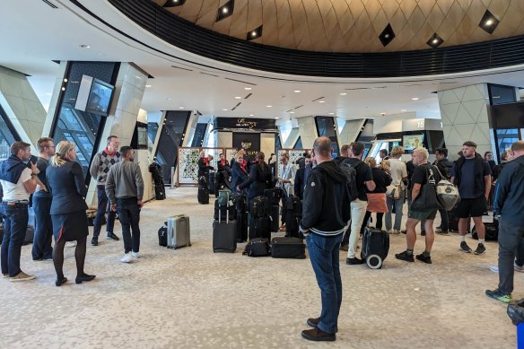 Qantas staff and passengers at Baku airport after their flight made an emergency landing en route from Singapore to London.