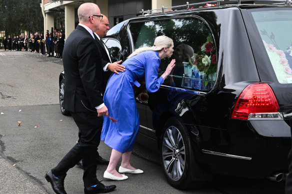 Parents Kelly and Mat say farewell to Charlotte outside the Mary Immaculate Catholic Church in Bossley Park.