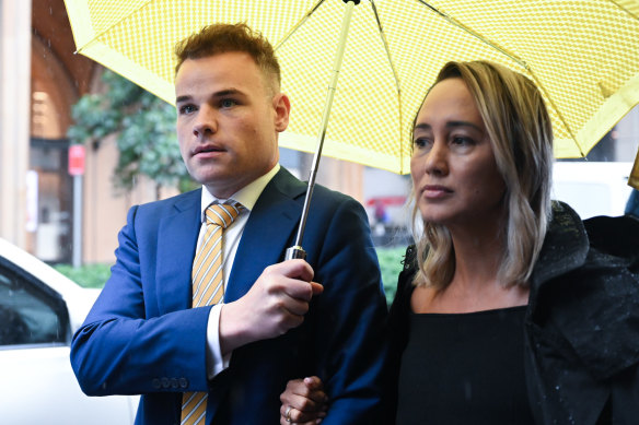 Taylor Auerbach leaves Federal Court with his lawyer Rebekah Giles after giving evidence in the Bruce Lehrmann defamation case in Sydney on Friday.