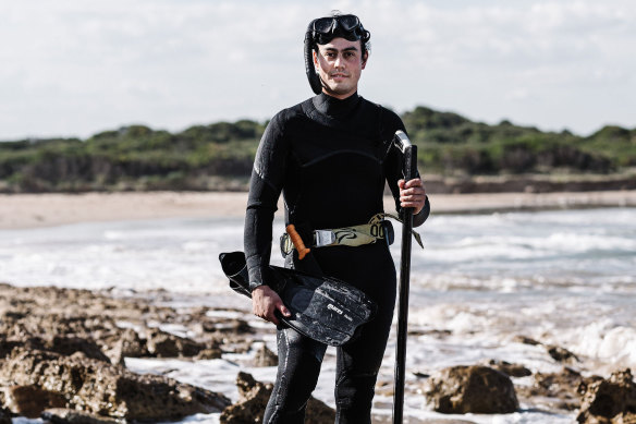 Tobin Kent fishing at a beach near his Moonah restaurant.
