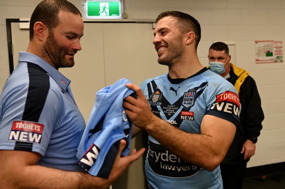 James Tedesco presents Boyd Cordner with one of his game jerseys.