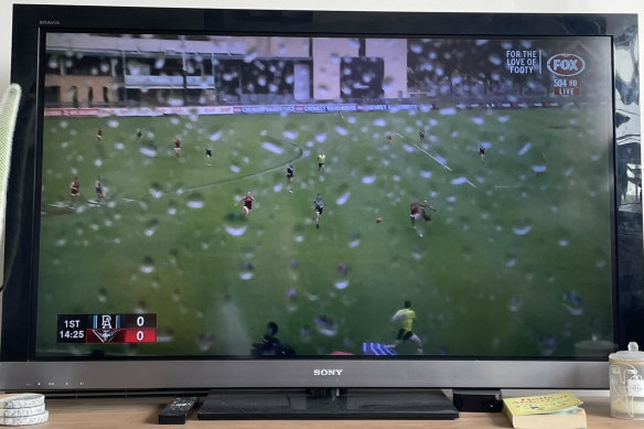 A wet TV camera makes it difficult to follow Port Adelaide’s game against Essendon at Alberton Oval last year.