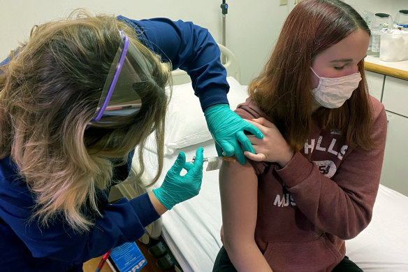 Teenager Katelyn Evans gets a Pfizer vaccination in a trial in Cincinatti. 