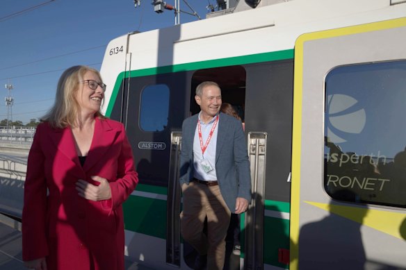 The Labor leaders disembark a Metronet train on the new line.