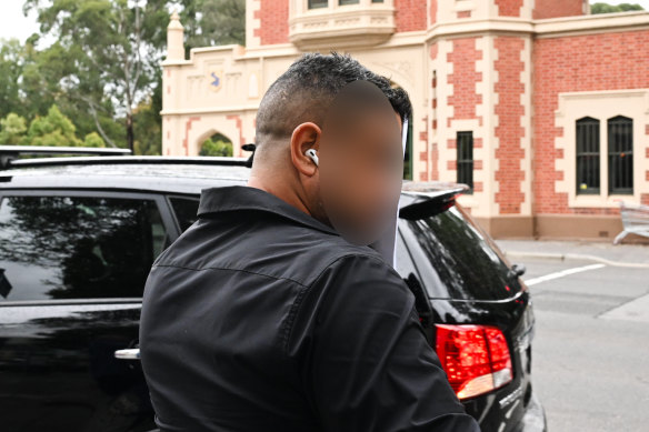 The father of a teenager accused of stabbing a priest in a Wakeley church leaves Parramatta Children’s Court.