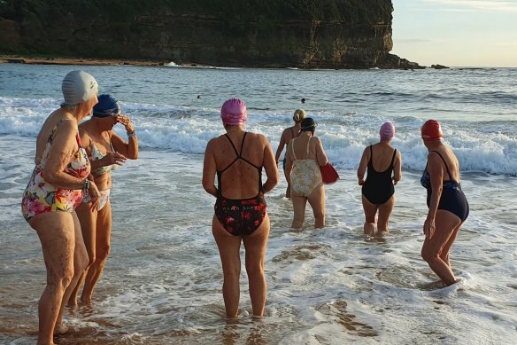 The Buckettes brave the waves for an early morning swim at Sydney’s Mona Vale Beach.
