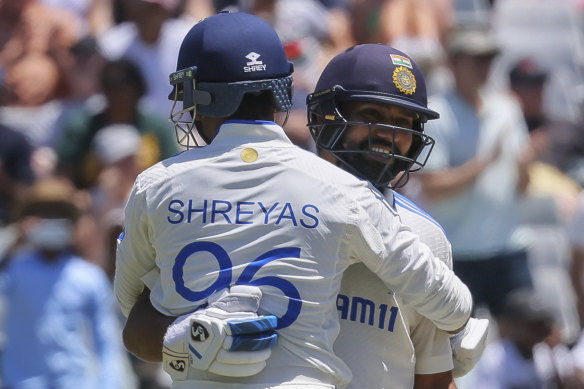 Indian skipper Rohit Sharma, right, celebrates the victory with teammate Shreyas Iyer.
