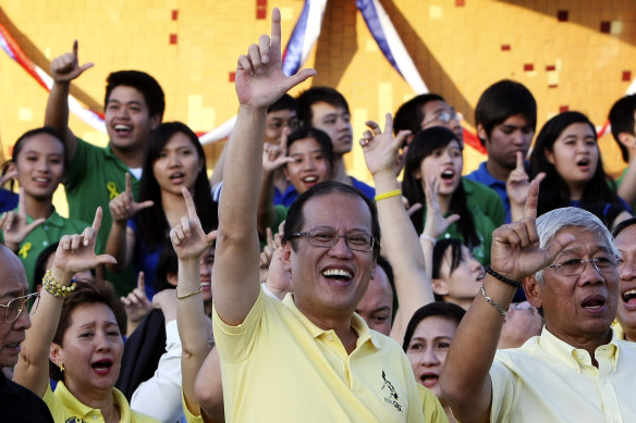 Benigno Aquino, centre, announced his presidential campaign in 2009 by saying he was answering the call of the people to continue his mother’s legacy. She had died just weeks earlier of colon cancer.