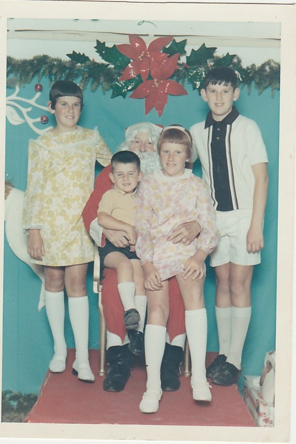 From left, siblings Peta, Dom, Lisa and Steve with Santa at Wollongong DJs in 1966.