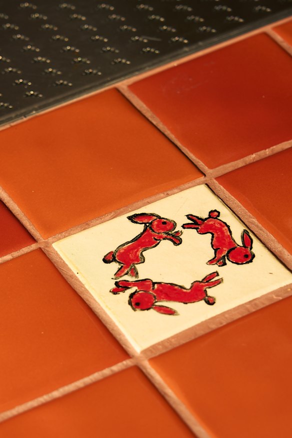 The tiled bar top includes some tiles with illustrations drawn by the team.