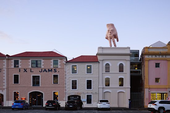 Quasi, by Ronnie van Hout, on a waterfront rooftop at Dark Mofo 2025.