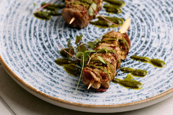 Lamb and guanciale skewers with chimichurri sauce.