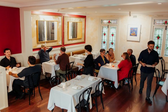 The claret-hued dining room. 
