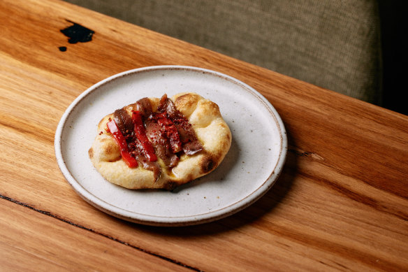 Bosco’s Cantabrian anchovy, olive and pickled pepper on oven flat bread.