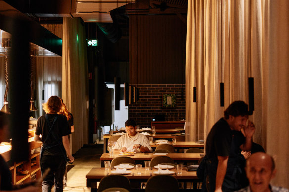 Bosco’s dining room, with its clever lighting and sheer curtains, resembles a gussied up dining hall.