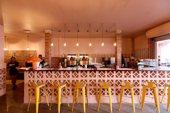 The front of the restaurant is dominated by a breeze-block-fronted bar.