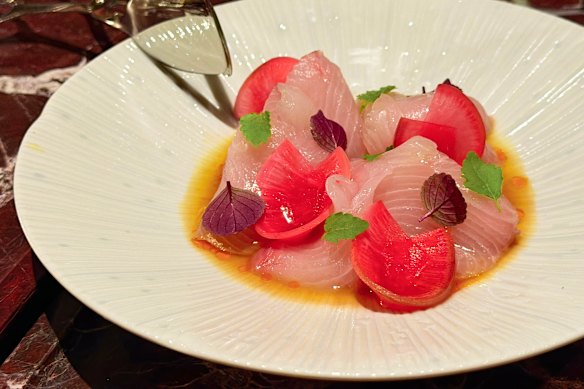 Raw kingfish with charred citrus soy, watermelon radish and macadamia chilli oil.