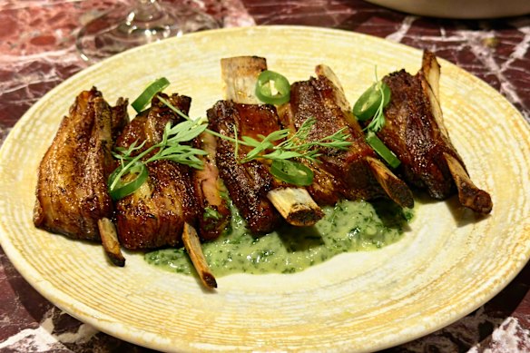 Charred lamb ribs with a coriander and anchovy dressing, and pickled green chilli.