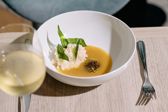 Miso buttered spanner crab with roasted corn and chicken skin cream.