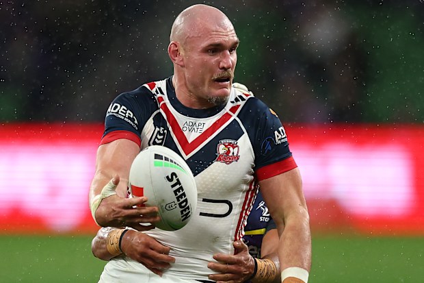 Roosters gun Angus Crichton shapes to offload.
