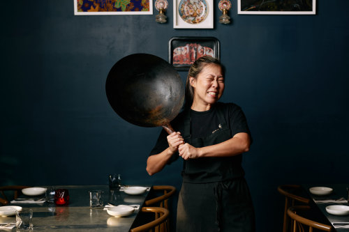 Emily Yeoh with a larger version of the $15 wok she recommends from Yuen’s in Brisbane, or a similar Asian grocery store.