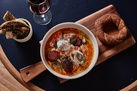 Emils’ Turkish eggs with sujuk sausage and simit bread.