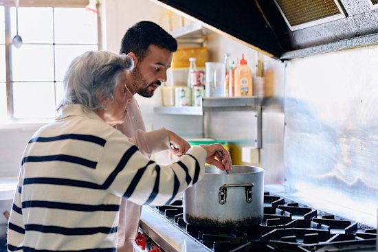 Fassy and Hinton cook together at Sultan’s Kitchen.