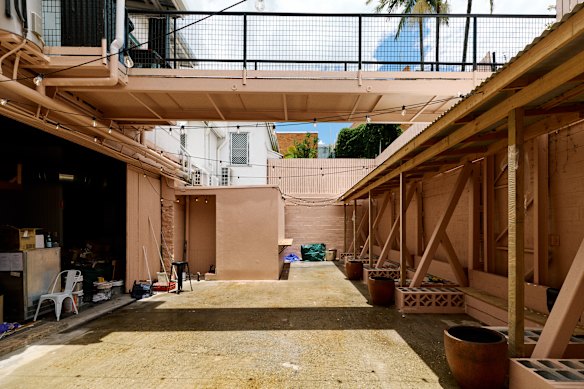 The majority of the dining will be in a booth-lined courtyard out back of the venue.