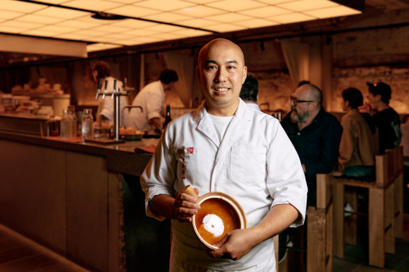 Chef Benny Lam pictured at his Central restaurant with the claypot he uses to cook rice at home.