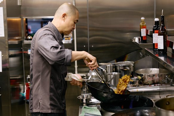 Kian Lai working the wok at Uncle Lai’s.