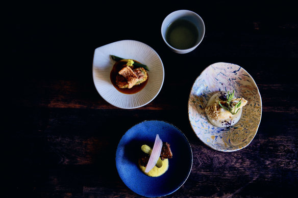 Soy-glazed lamb sholder, miso corn puree, vanilla-cured shallot; soy-braised pork croquette, Japanese barbecue sauce and pork skin cracker; masago arare cracker pink snapper, blueberry powder and tofu aioli.