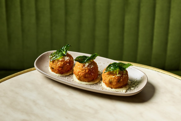 Arancini with speck, fontina and peas.