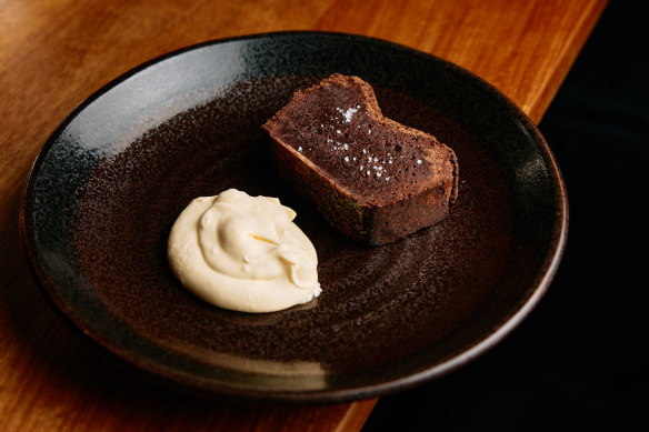 Milquetoast’s chocolate cake served with vanilla cream.