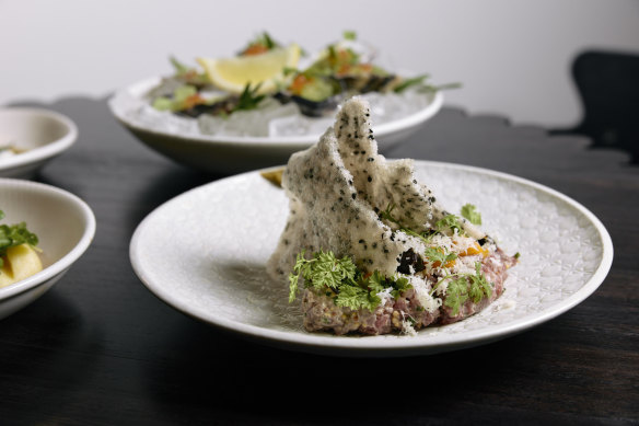 Steak tartare with yolk, horseradish and sesame crackers.