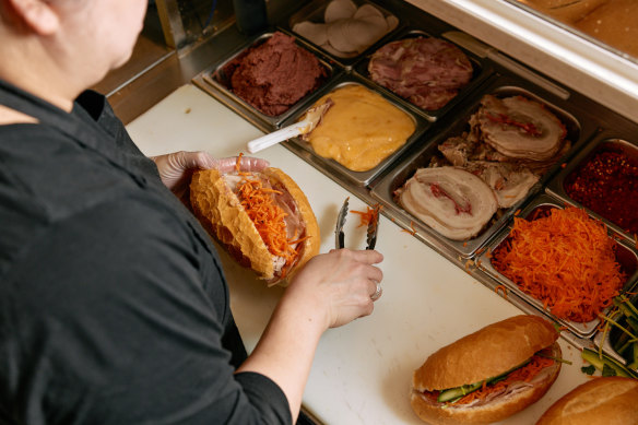 On a busy day, Minh Tan will sell more than 300 banh mi.