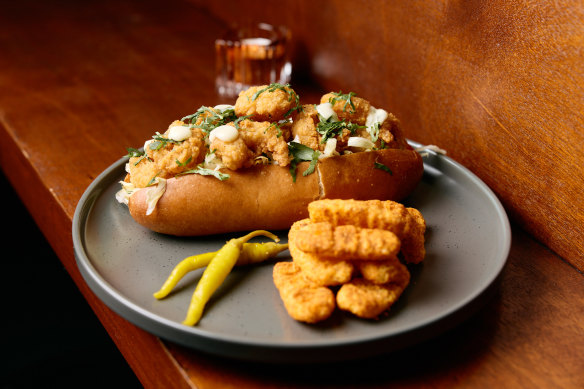 Fried prawn po’ boy with iceberg lettuce, tomato, pickles and herb aioli.