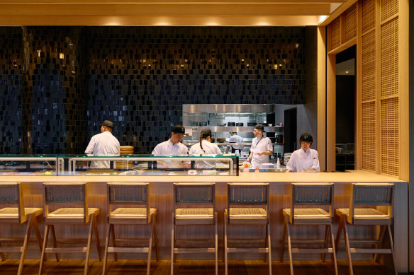 A lengthy sushi bar is one of the key design elements of the restaurant.