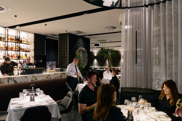 Fatcow boasts a glitzy fitout with black parquet flooring and eye-catching white marble counter tops.