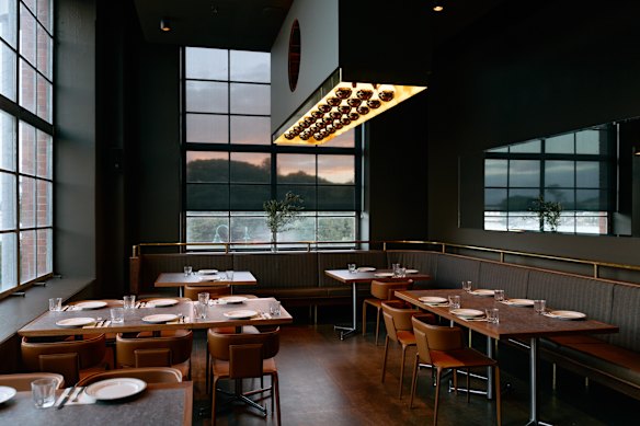 A series of hanging light boxes act as a through line for the entire design.