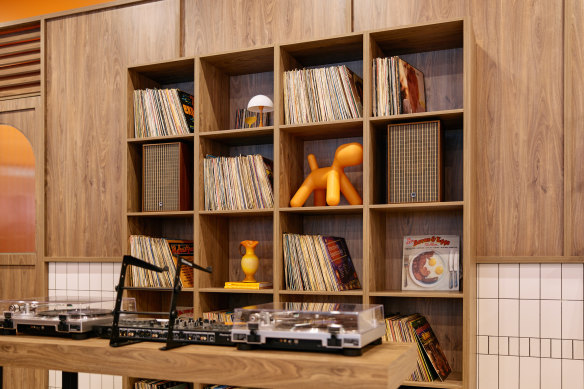 Two Yolks has a pair of turntables and a wall of vintage vinyl.