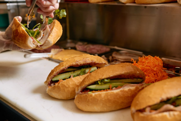 The banh mi at Minh Tan come stuffed full of pork, pickled carrot, cucumber and coriander.